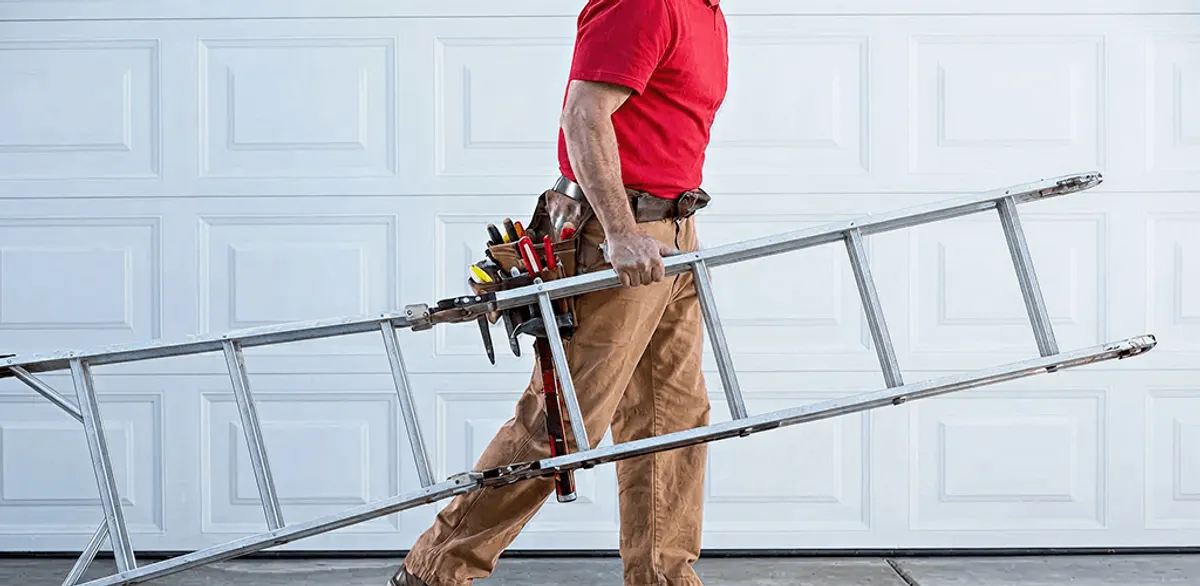 Garage door repair technician arriving with tools and ladder in Dallas, TX