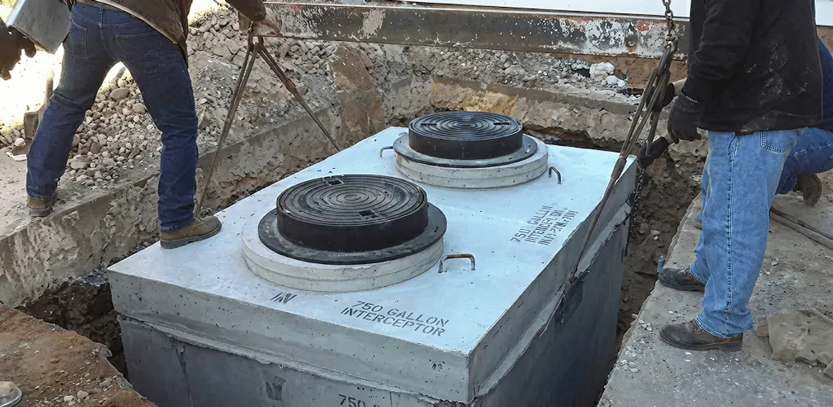 Grease trap installation for a commercial property drainage system in Dallas, TX