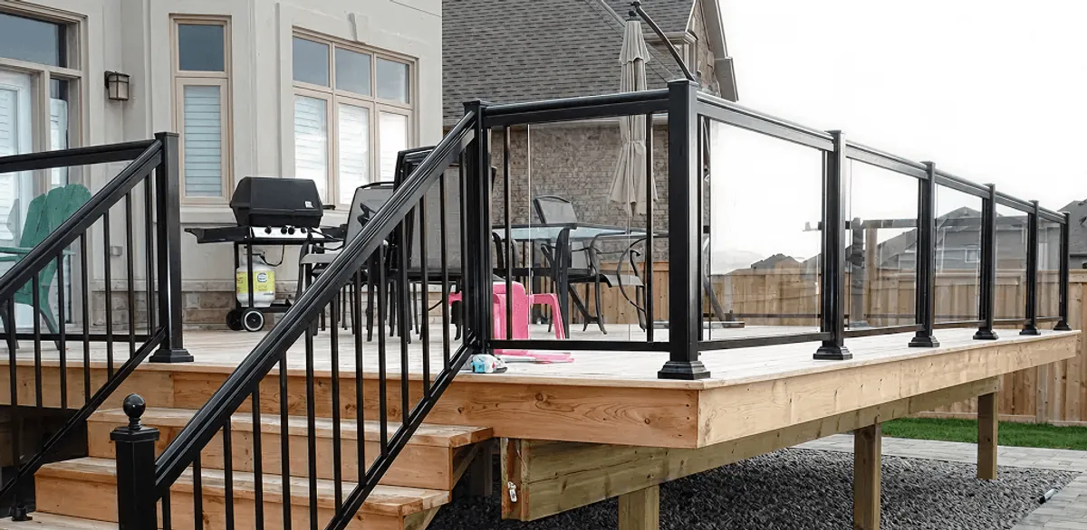 Handrail installation on a deck staircase for safety and code compliance in Dallas, TX